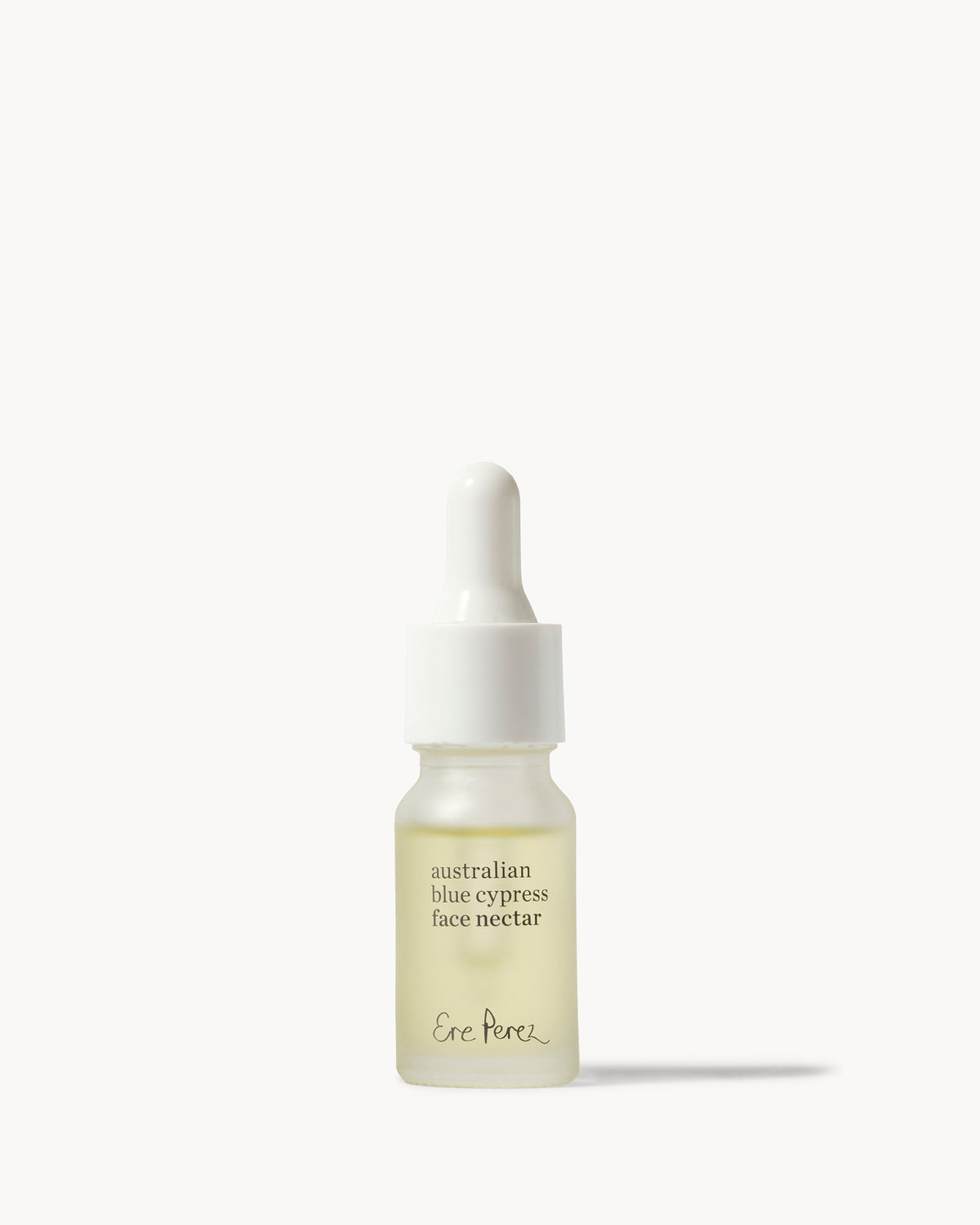 A small glass dropper bottle of Ene Porek Australian Blue Cypress Face Nectar with pale yellow liquid inside, set against a clean off-white background 