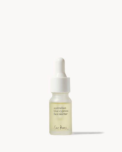 A small glass dropper bottle of Ene Porek Australian Blue Cypress Face Nectar with pale yellow liquid inside, set against a clean off-white background 