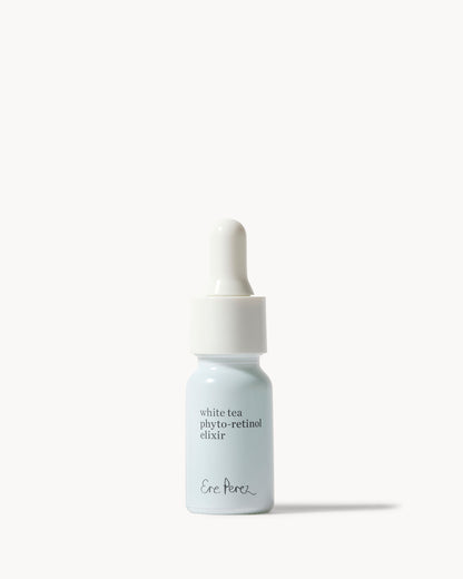A small dropper bottle of Ere Perez White Tea Phyto-retinol Elixir serum, featuring a white bottle and a white dropper cap, set against a clean off-white background 