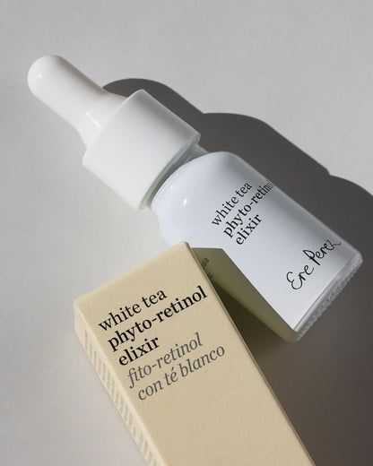A white dropper bottle labeled &