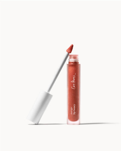 Organic mango lip gloss by Ere Perez in its tube 