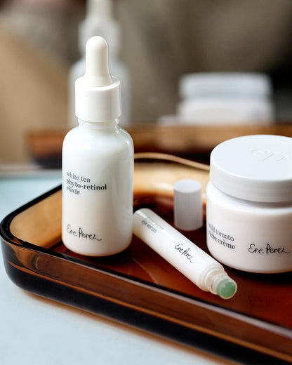 Radiance restore set with white tea photo-retinol elixir bottle , grape water eye serum tube and wild tomato riche creme pot for moisturising anti-ageing effect