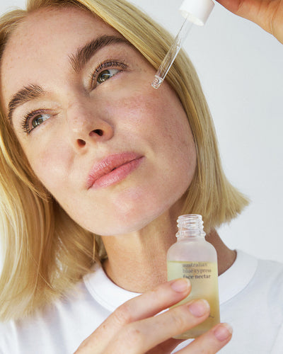 Natural Australian blue cypress moisturiser being applied on the face for a refreshing brightening