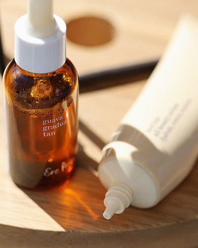 bottle of guava gradual tan and tube of moringa all-beauty creme