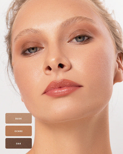 Blonde model with natural warm brown Element Matte eyeshadow. 