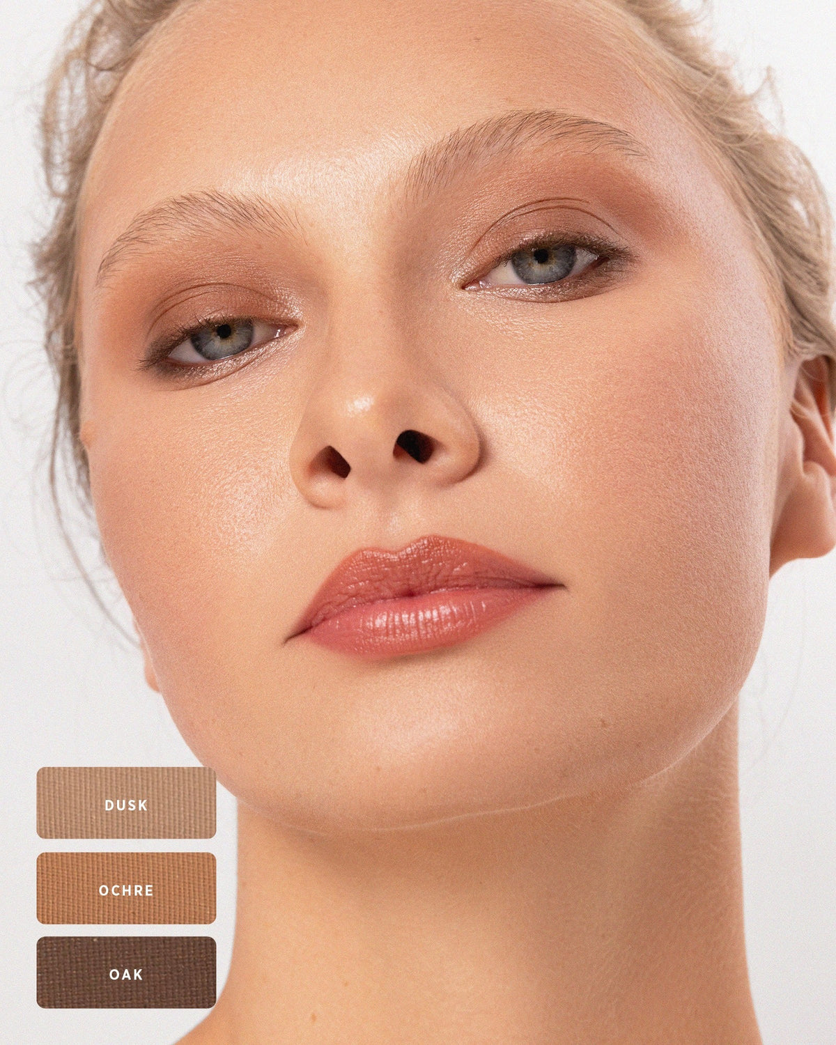 Blonde model with natural warm brown Element Matte eyeshadow. 