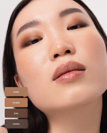 Model with softly blended brown Element Matte smokey eye and shade swatches. 