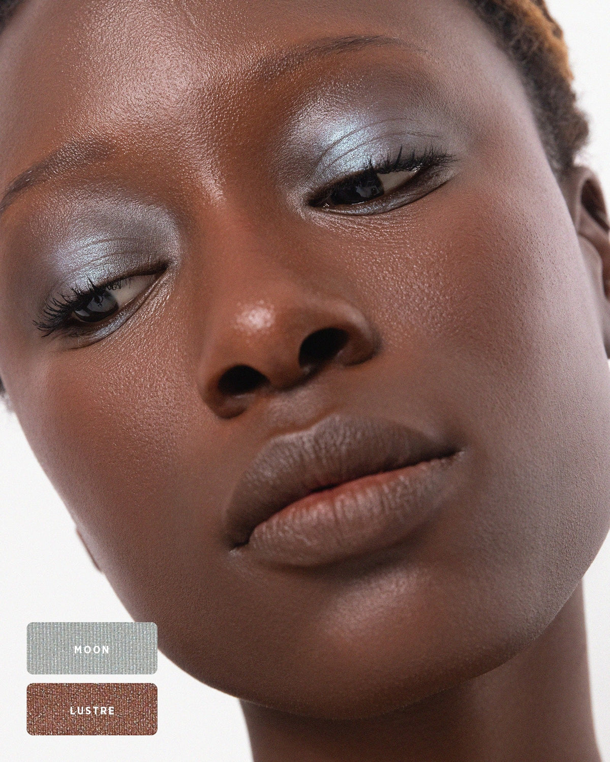 Model applying Light Shimmer eyeshadow using Eco Vegan Eye Duo Brush. 