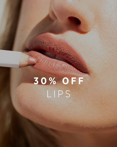 30% OFF LIPS. Close-up of a person applying lipstick with a brush, promotional text overlay 