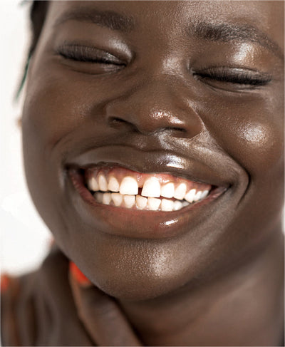 clear cruelty-free mango lip honey by Ere Perez applied on the lips for a hydrating gloss 