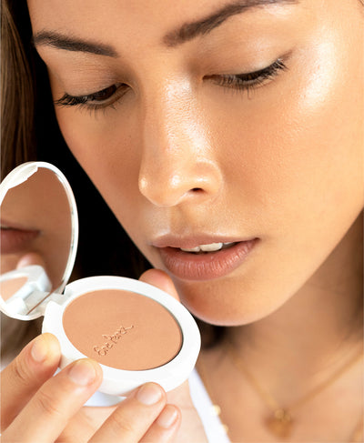 compact of organic tapioca cheek colour by Ere Perez applied to skin for a natural healthy look