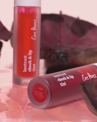 Ere Perez natural beetroot cheek &amp; lip tint applied on the skin for a pop of colour 