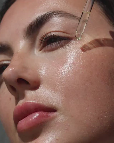 Australian blue cypress face nectar applied on skin and used to sculpt face with stainless-steel tool