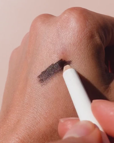 swatch of jojoba eye pencil that Is then applied to the skin for accentuated features 